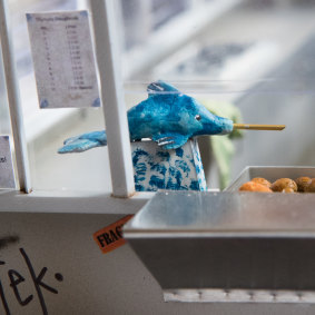 Miniature dolphin jam dispenser and doughnuts in Hourigan's Olympic Doughnuts model. 