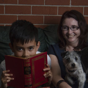 Julie Peno and her son Declan read together at home.