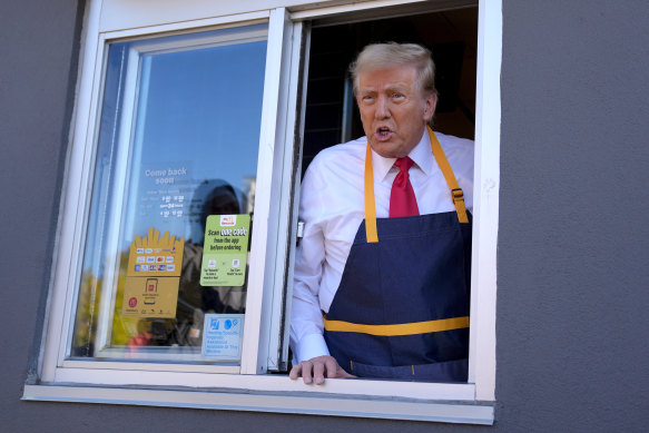 Donald Trump works a drive-thru window at McDonald’s during last year’s election campaign.
