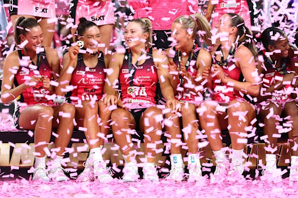 The Adelaide Thunderbirds celebrate their 2026 Super Netball title win in Melbourne.