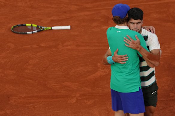 Sinner and Alcaraz embrace after their epic five-setter in last year’s Roland-Garros final.