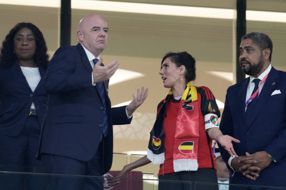 Belgium’s Foreign Minister Hadja Lahbib wears a “One Love” armband while talking to FIFA president Gianni Infantino.