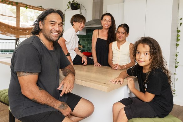 Melanie and Vince Purcell, pictured with their children, have listed their home in Kurnell. 