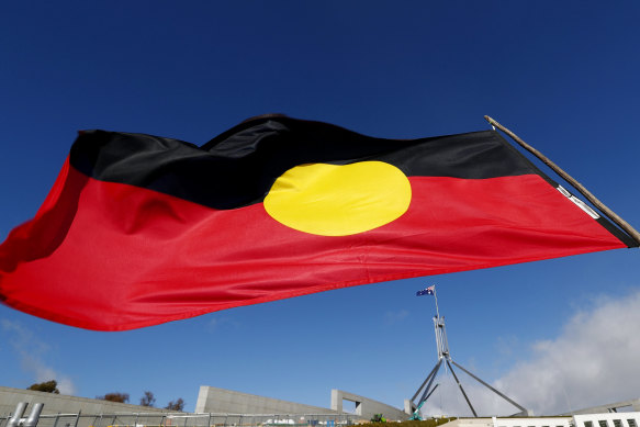 The Aboriginal flag flying over Parliament House in Canberra.