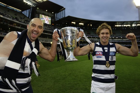 Mitch Duncan (right) is one of four players remaining in Geelong's team from their 2011 premiership side.