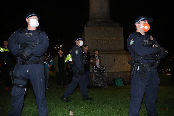 A statue of James Cook was surrounded by police.