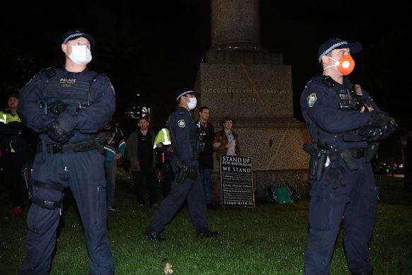 A statue of James Cook was surrounded by police.