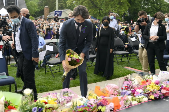 Canada’s Prime Minister Justin Trudeau places flowers at a vigil for the victims of the deadly vehicle attack in London, Ontario.