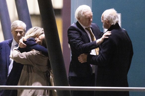 Julian Assange and his father, John Shipton, reunite at the airport.