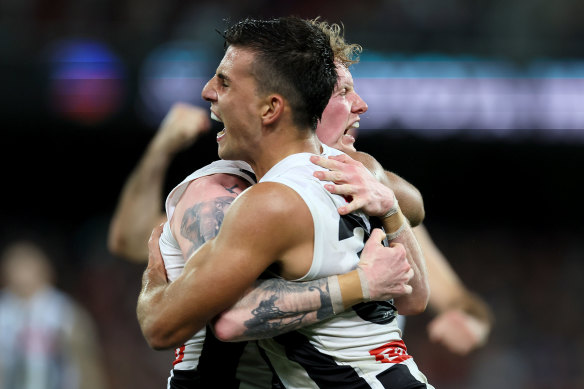 Nick Daicos and John Noble celebrate a goal against the Crows.