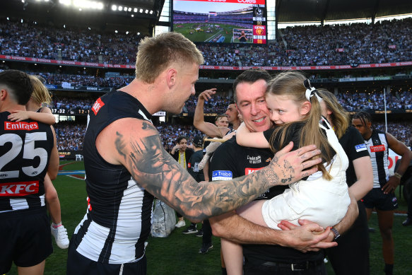 Jordan De Goey and Craig McRae celebrate victory.