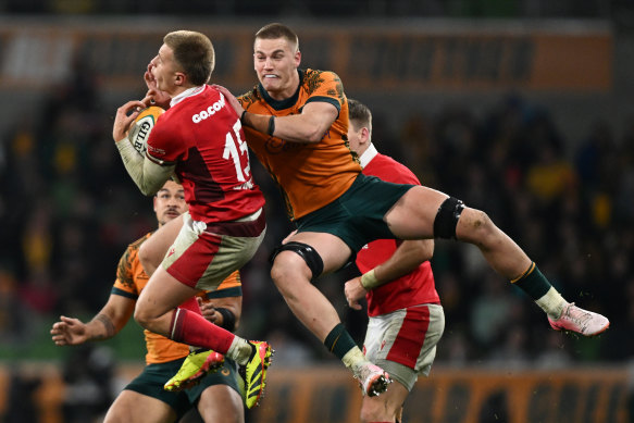 Charlie Cale competes for the ball for the Wallabies earlier tonight