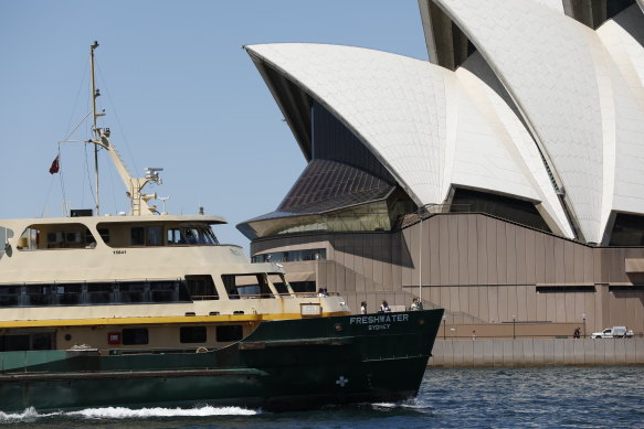A Freshwater ferry passes the Sydney Opera House ... would the latter have been built had it been subjected to a crude cost-benefit analysis? Yet its economic return for Sydney is not questioned today.  