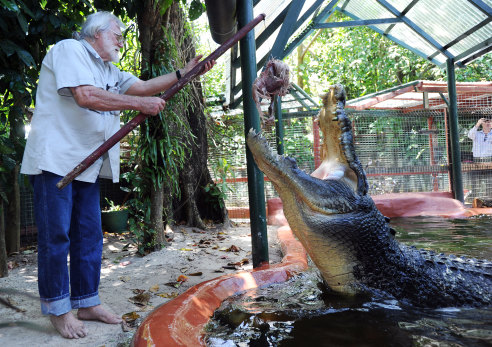 George Craig feeds a chicken to saltwater crocodile “Cassius” at Green Island on the Great Barrier Reef in Queensland, 2011.
