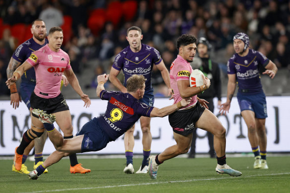 Panther Izack Tago evades Storm’s Harry Grant to score a try.