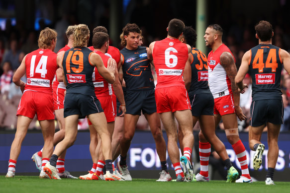 Swans and Giants players scuffle just before half-time.