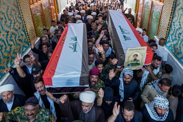Members of the Popular Mobilization Forces attend a funeral for fighters killed in a US airstrike in Tal Afar, north of Baghdad, Iraq, during the week.
