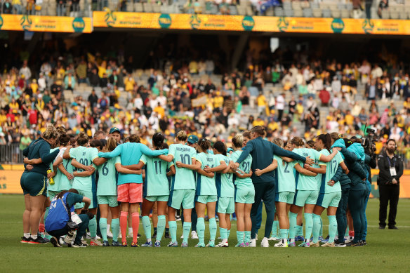 The Matildas have their team meeting after their 8-0 win on Sunday night.