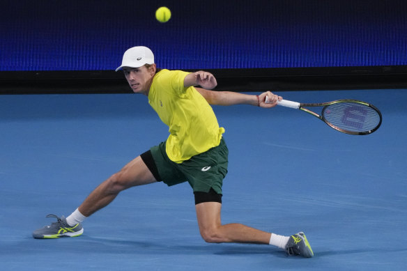 Australia’s Alex de Minaur plays a forehand return to Spain’s Rafael Nadal.