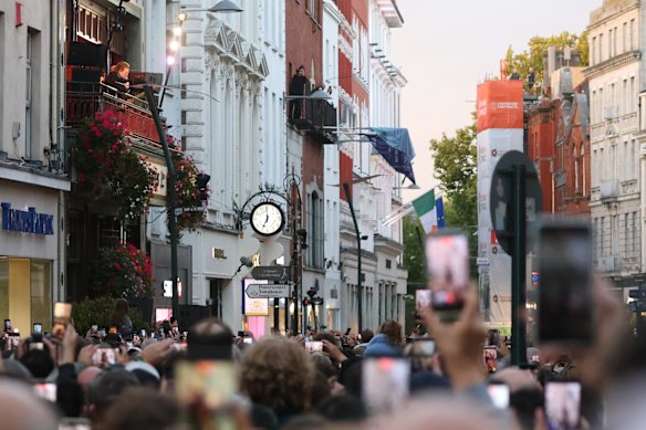 Crowd lapping up the impromptu concert from U2 in Grafton Street – one of Dublin’s main pedestrian thoroughfares.