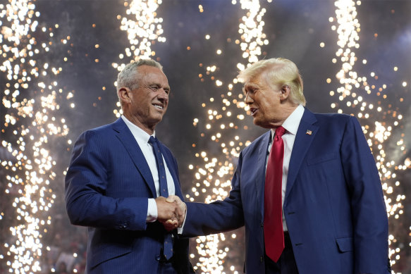 Republican presidential nominee Donald Trump welcomes Robert Kennedy Jr to his rally in Arizona on Friday.