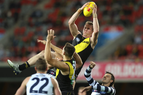 Dylan Grimes flies for a mark against the Cats earlier this year.