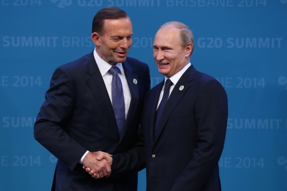 Former Prime Minister Tony Abbott welcomes the Russian President Vladimir Putin to the G20 in Brisbane in 2014.