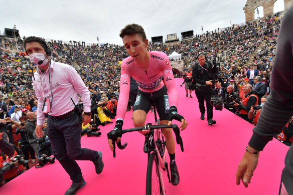 Jai Hindley rides to the podium in a packed Roman amphitheatre after becoming the first Australian to win the Giro d’Italia. 
