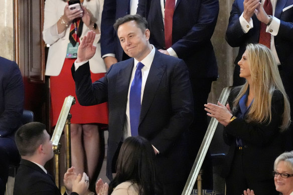 Elon Musk gestures as President Donald Trump name-checks him during his address to the US Congress.
