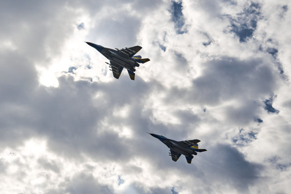 Two MIG-29 planes stage a flypast in honour of Ukrainian pilot Oleksiy Mes.