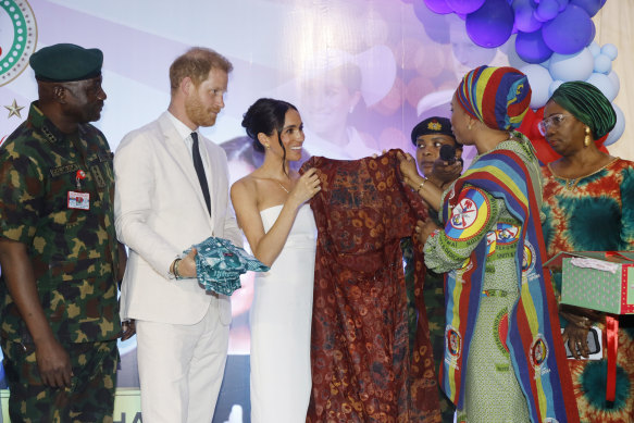 Meghan received a Nigerian fabric as a gift alongside Harry at an Invictus Games event.