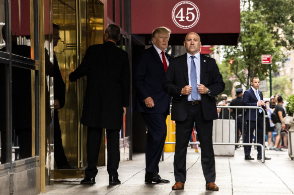 Former president Donald Trump departs Trump Tower in Manhattan en route to a deposition at the office of the state attorney general on Wednesday morning, August 10.