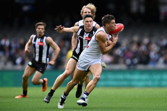 Darcy Tucker tackled by Jack Crisp.