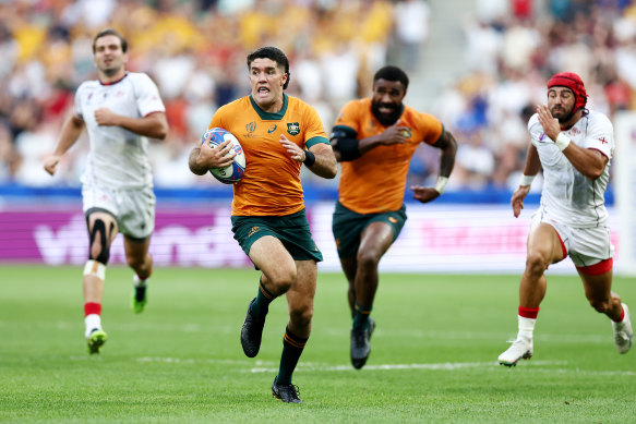 Ben Donaldson breaks forward to score his side’s third try during the Rugby World Cup against Georgia.