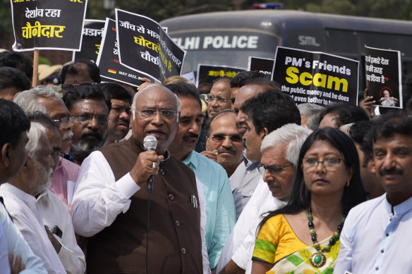 Congress party president Mallikarjun Kharge, centre, with other opposition lawmakers demanding an investigation into alleged accounting fraud and stock manipulation by the Adani Group.