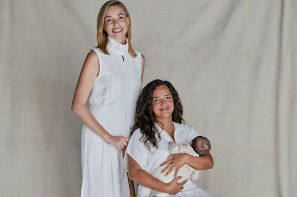 Ashleigh Raper (standing) carried baby Mia as a surrogate for her best friend, Lucy Koops.