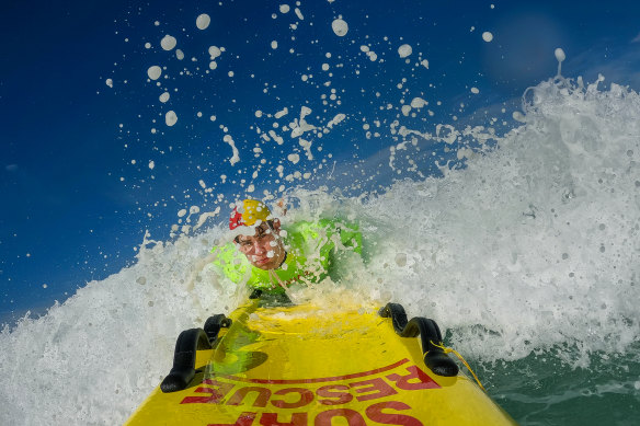 Lifeguard Jack Liszukiewicz taking to the waves in Gunnamatta.