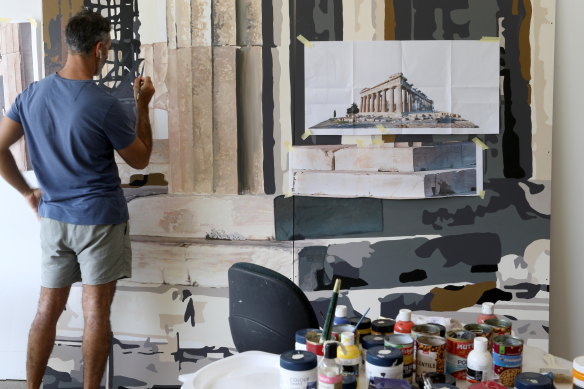 Michael Zavros working on Acropolis Now, which will serve as a backdrop during his exhibition at GOMA.