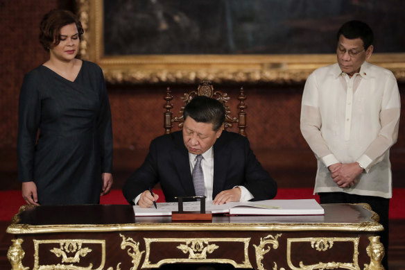 Daughter Sarah Duterte, seen here on left with Chinese President Xi Jinping and her father President Rodirgo Duterte at the Malacanang Palace in 2019, has been talked about as a possible successor.