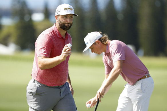  Jon Rahm with Smith on the ninth hole in Hawaii.