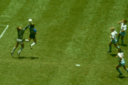 Maradona outjumps England goalkeeper Peter Shilton to score his 'Hand of God' goal.