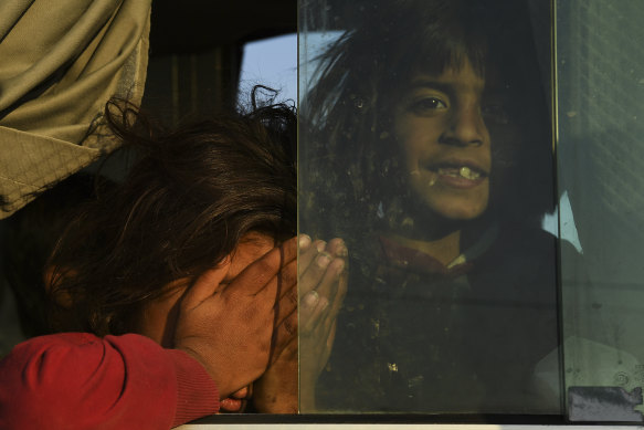 Syrian refugees are taken on buses to Bardarash refugee camp in Iraqi Kurdistan.