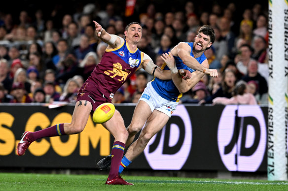 Joe Daniher and Sam Collins battle for the ball.