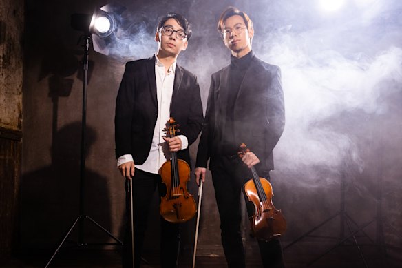 Brett Yang (left) and Eddy Chen have postponed the start of their world tour after Yang was denied a US visa.