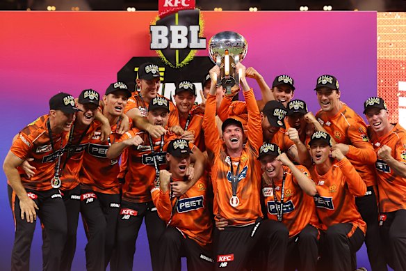 The Perth Scorchers lift the BBL trophy.