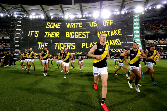 Jack Riewoldt leads the Tigers out.
