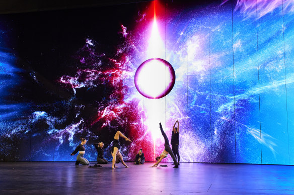 Performers rehearse in front of one of Leigh Sachwitz’s striking backdrops for <i>The Ring Cycle</i>.