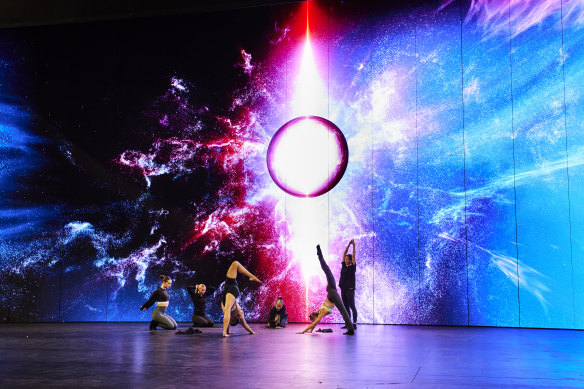 Performers rehearse in front of one of Sachwitz’s striking backdrops