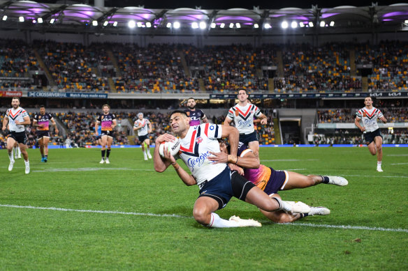 Daniel Tupou dives over for his 140th try for the Roosters on Thursday night.
