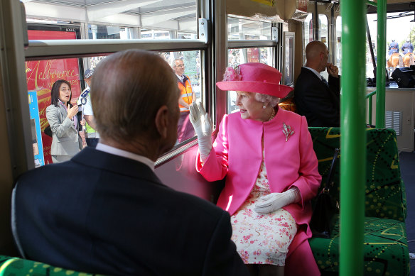 Queen Elizabeth II rides the royal tram through Melbourne in 2011.